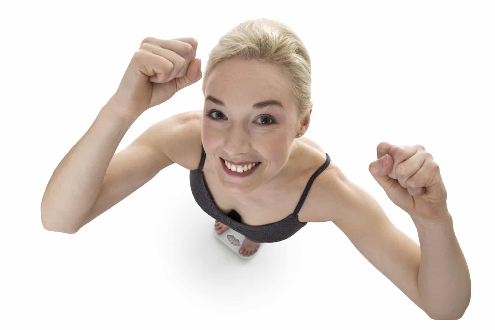 happy fitness happy woman shoot from above of woman standing on scales